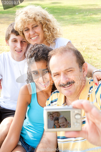 Image of Happy family taking self portrait