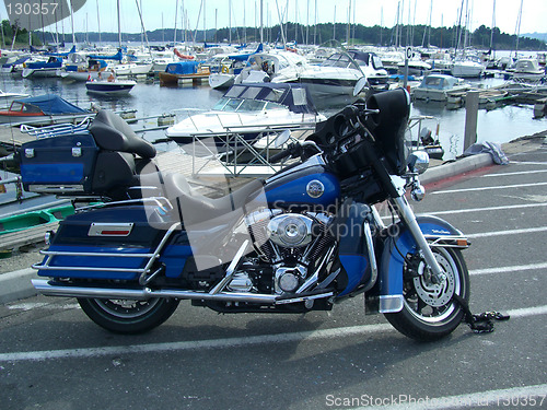 Image of motobike and boats