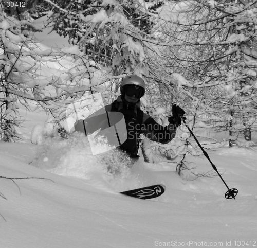 Image of A happy skier pumping fresh powder