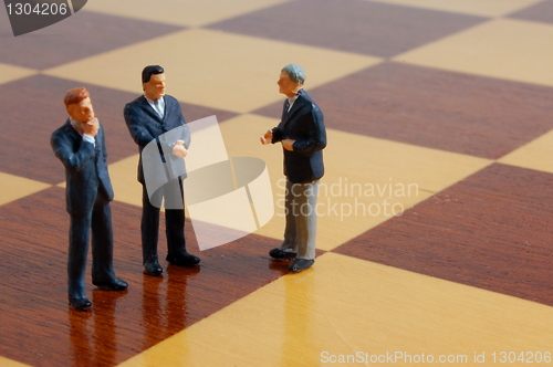Image of business man on a chess board