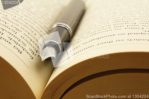 Image of book and pen