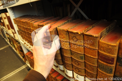 Image of old books in a library