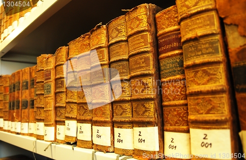 Image of old books in a library