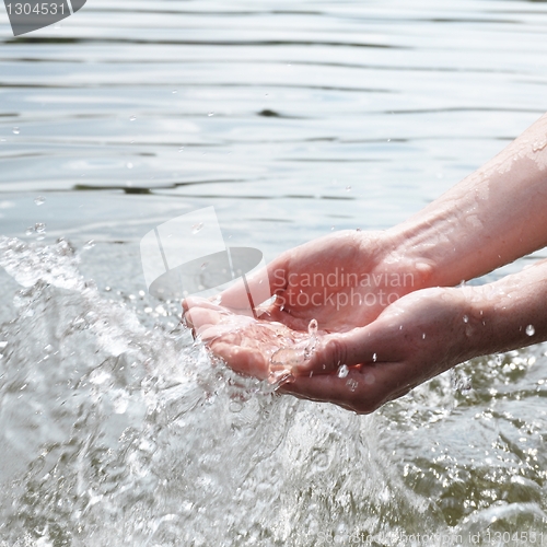 Image of hand an water