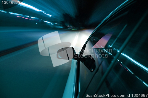 Image of night drive with car in motion 