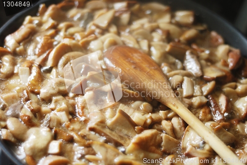 Image of delicious fried mushrooms in a skillet 