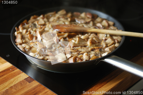 Image of delicious fried mushrooms in a skillet 