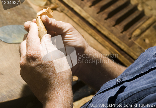 Image of hand rolling cigar production