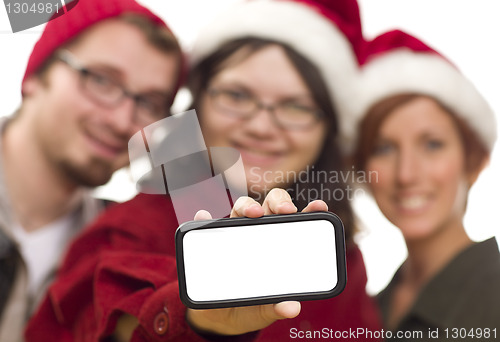 Image of Girl with Friends and Santa Hats Holding Blank Smart Phone