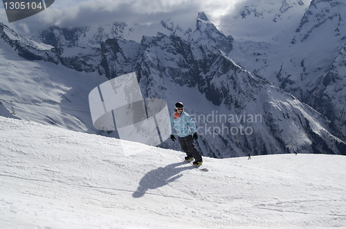 Image of Snowboarder on ski slope