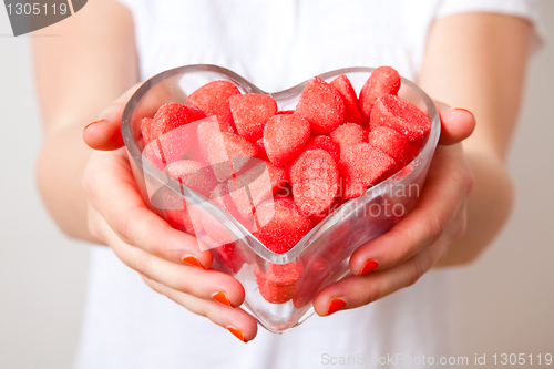 Image of Woman with red sweets