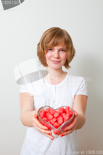 Image of Woman with red sweets