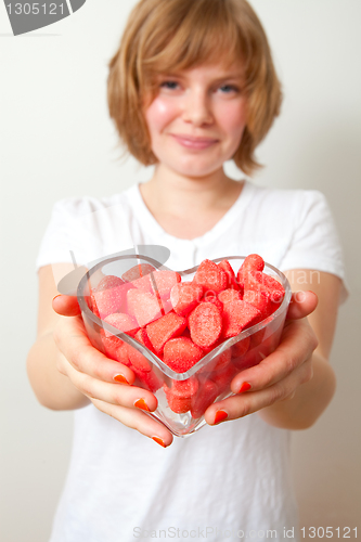 Image of Woman with red sweets