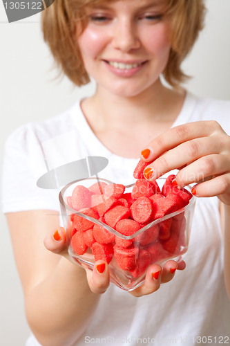 Image of Woman with red sweets