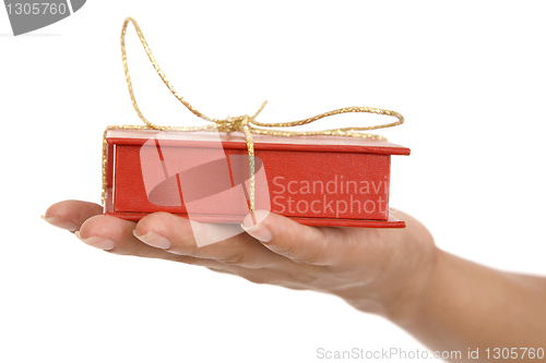 Image of red gift box in hand girls