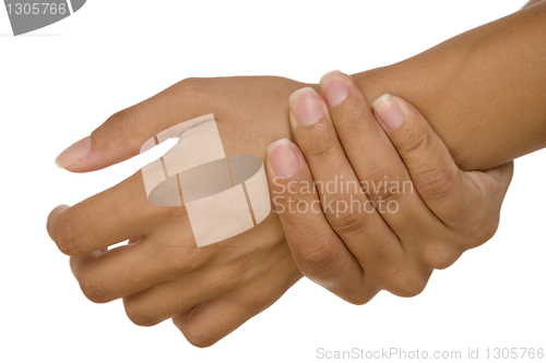 Image of human hand measuring arm pulse