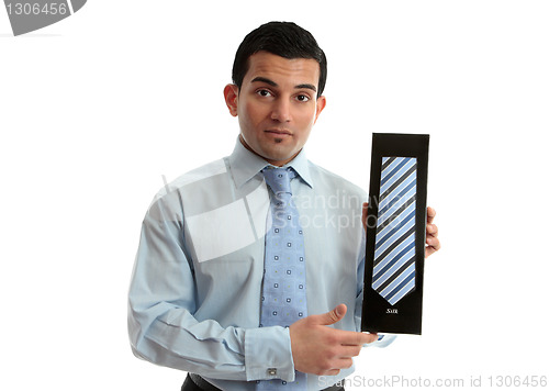 Image of Salesman holding a tie