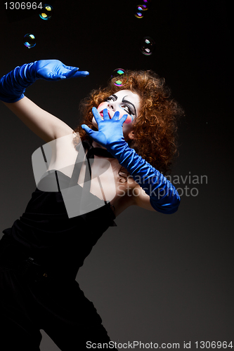 Image of woman mime with soap bubbles.