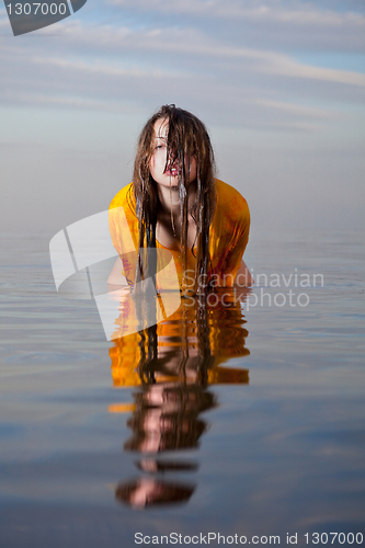 Image of girl posing in the Water at sunset