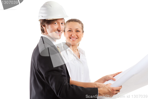 Image of An architect wearing a hard hat and co-worker