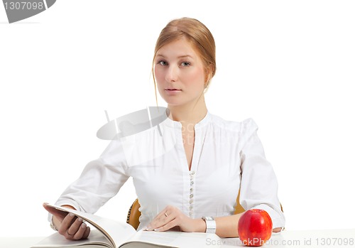 Image of woman with apple and book