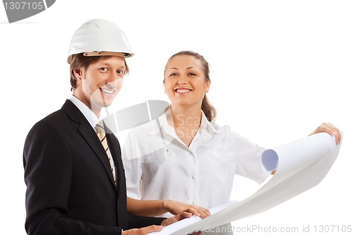 Image of An architect wearing a hard hat and co-worker