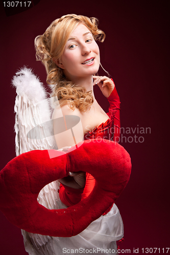 Image of Perfect blonde angel with a red heart