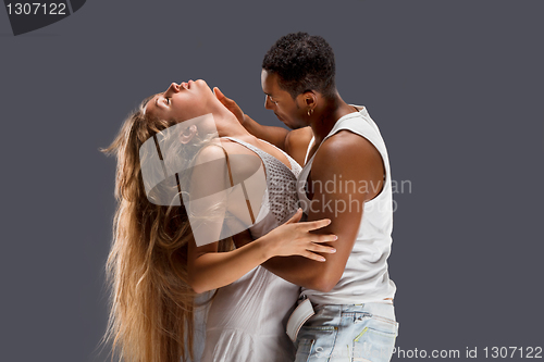 Image of Young couple dances Caribbean Salsa