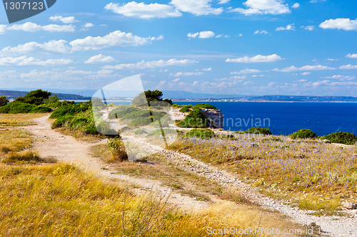 Image of Mediterranean sea coast at sunset.