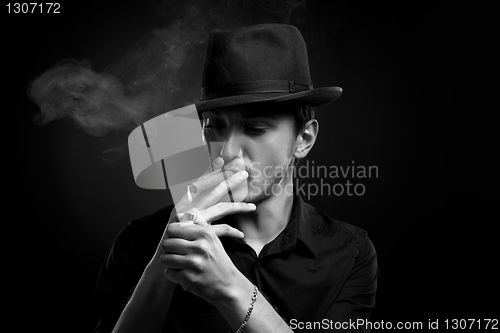 Image of Man with hat and cigar in Black & White