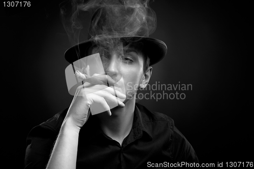 Image of Man with hat and cigar in Black & White