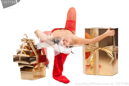 Image of Beautiful christmas woman in santa hat