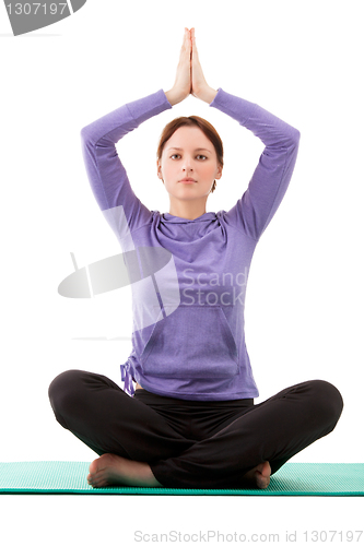 Image of Young woman practicing yoga