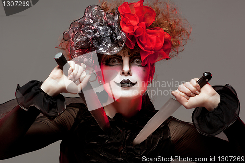 Image of woman mime with knife