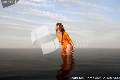 Image of girl posing in the Water at sunset