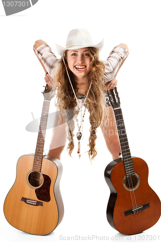 Image of Sesy cowgirl in cowboy hat with acoustic guitar