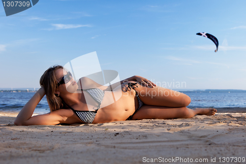 Image of girl lying on a beach