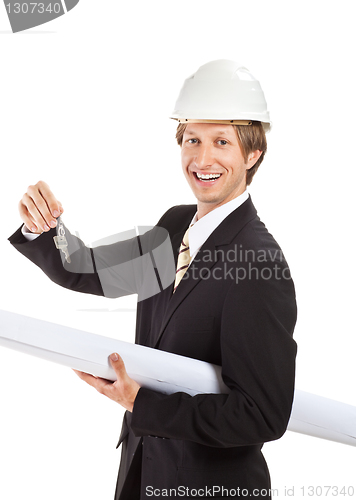 Image of smiling engineer giving keys from apartment