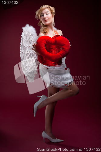 Image of Perfect blonde angel with a red heart