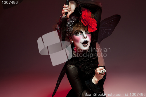 Image of woman mime with knife