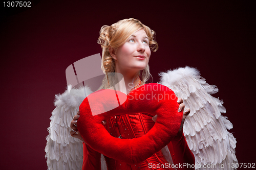 Image of Perfect blonde angel with a red heart