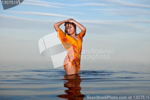 Image of girl posing in the Water at sunset