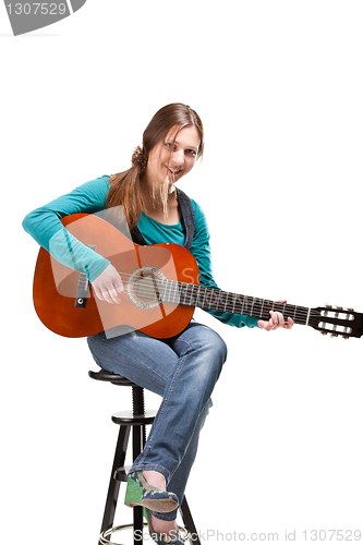 Image of cowgirl in ahat with acoustic guitar