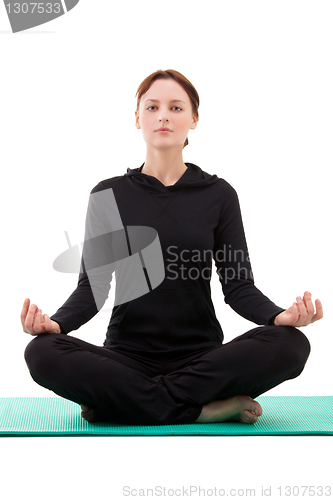 Image of Young woman practicing yoga