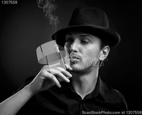 Image of Man with hat and cigar in Black & White