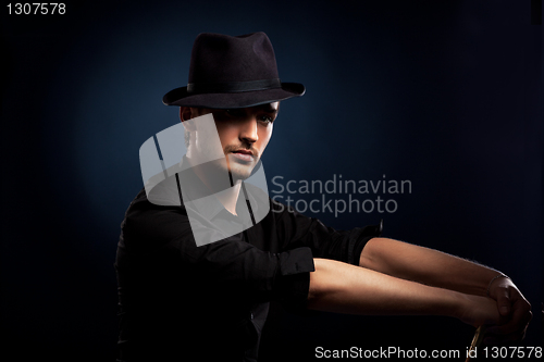 Image of man in a black hat