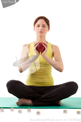 Image of woman in sportswear with apple