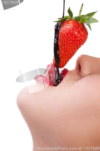 Image of girl eating strawberry with chocolate sauc