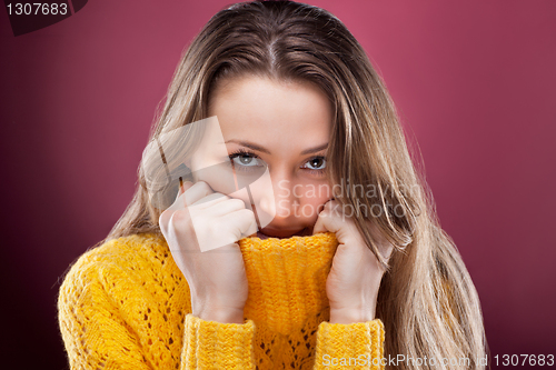 Image of Perfect blonde on red background