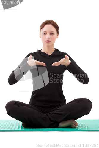Image of Young woman practicing yoga